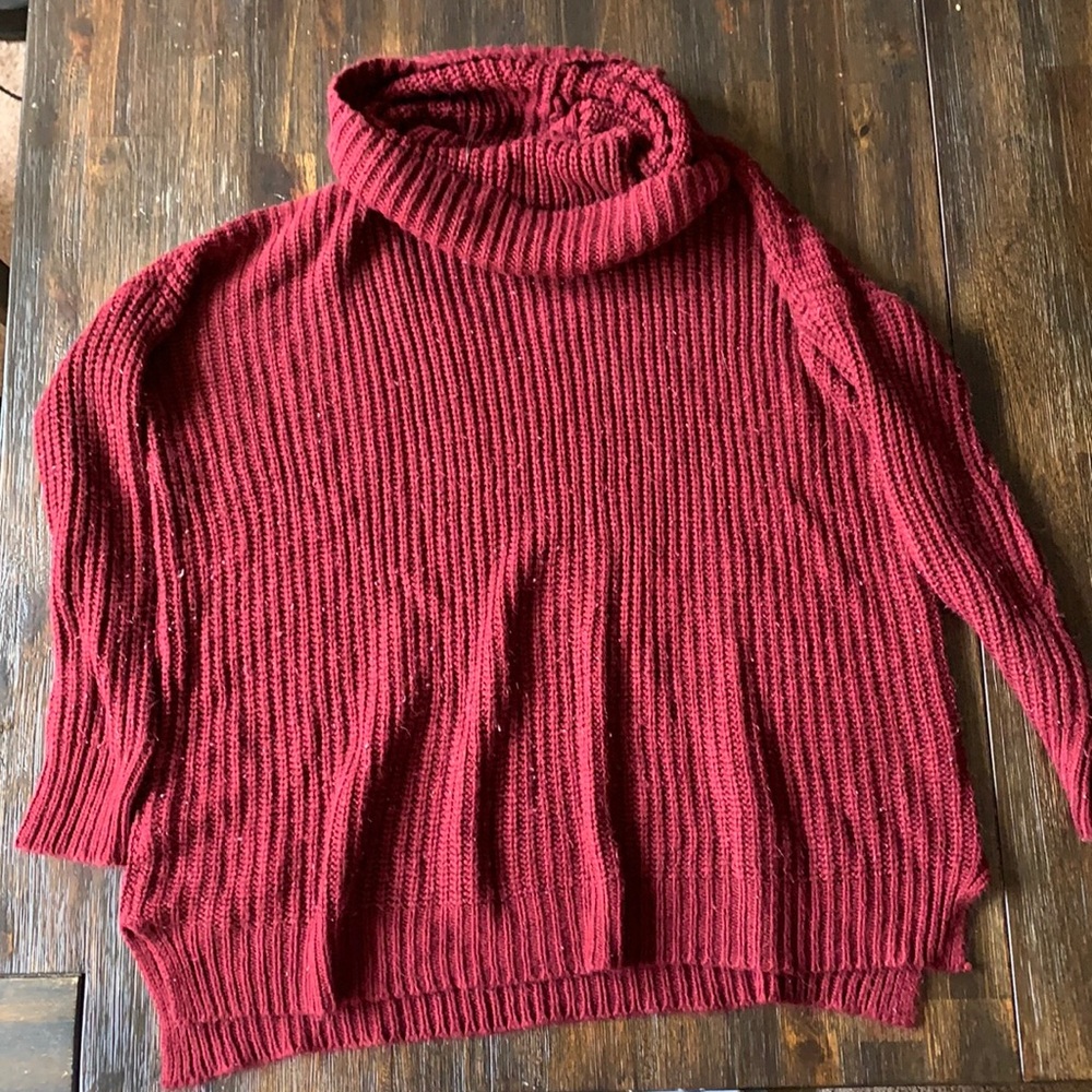 Medium red knit sweater.